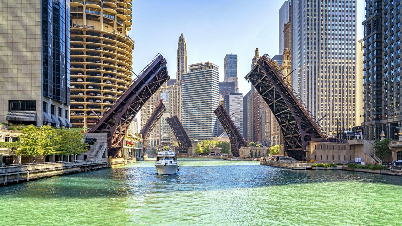 Chicago River with bridges lifted, city skyline in daylight